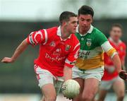 1 November 1998; Brendan O'Sullivan of Cork in action against Sean Grennan of Offaly during the Church & General National Football League match between Offaly and Cork at O'Connor Park in Tullamore, Offaly. Photo by David Maher/Sportsfile