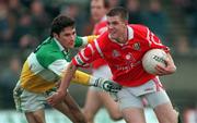 1 November 1998; Brendan O'Sullivan of Cork in action against Vinny Claffey of Offaly during the Church & General National Football League match between Offaly and Cork at O'Connor Park in Tullamore, Offaly. Photo by David Maher/Sportsfile