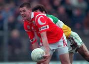 1 November 1998; Brendan O'Sullivan of Cork in action against Vinny Claffey of Offaly during the Church & General National Football League match between Offaly and Cork at O'Connor Park in Tullamore, Offaly. Photo by David Maher/Sportsfile