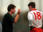 1 November 1998; Referee Brian White issues a yellow card to Tyrone substitute Ciaran Gourley during the Church & General National Football League match between Dublin and Tyrone at Parnell Park in Dublin. Photo by Ray McManus/Sportsfile