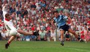 20 August 1995; Jason Sherlock of Dublin shoots past Cork goalkeeper Kevin O'Dwyer to score his side's goal during the Bank of Ireland All-Ireland Senior Football Championship Semi-Final match between Dublin and Cork at Croke Park in Dublin. Photo by David Maher/Sportsfile