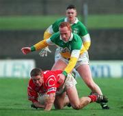 1 November 1998; Padraig O'Mahony of Cork in action against James Stewart of Offaly during the Church & General National Football League match between Offaly and Cork at O'Connor Park in Tullamore, Offaly. Photo by David Maher/Sportsfile