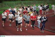 25 December 2002; 'Compeditors' take part in one of the many 'Goal Mile&quot; at Belfield on Christmas Day. Athletics. Picture credit; Ray McManus / SPORTSFILE