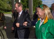 14 September 2012; An Taoiseach Enda Kenny T.D. takes paralympian Anne Marie McDaid, from Ramelton, Co. Donegal, into Farmleigh House for a government reception for the Irish Paralympic Team. Farmleigh House, Phoenix Park, Dublin. Picture credit: Brian Lawless / SPORTSFILE