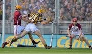 30 September 2012; Colin Fennelly, Kilkenny, holds off the challenge of Galway's Johnny Coen on the way to scoring his side's third goal. GAA Hurling All-Ireland Senior Championship Final Replay, Kilkenny v Galway, Croke Park, Dublin. Picture credit: Brendan Moran / SPORTSFILE