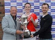 6 October 2012; Pat Quill, President, Ladies Gaelic Football Association, and Patrick O'Connor, from Tesco, present Amanda Casey, captain of Donaghmoyne, Co. Monaghan with the Senior Championship Cup at the 2012 Tesco All-Ireland Ladies Football Club Sevens. Naomh Mearnóg GAA Club, Portmarnock, Co. Dublin. Photo by Sportsfile