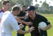 16 January 2003; Armagh goalkeeper Benny Tierney, right, in jovial mood with Peter Canavan, Tyrone, and Armagh Captain Kieran McGeeney after a light training session in preparation for the Vodafone GAA All-Star exhibition game. Robb Field, Bacon Street, Ocean Beach, San Diego, California, USA. Picture credit; Ray McManus / SPORTSFILE *EDI*