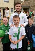 9 October 2012; Three, proud sponsors of the Republic of Ireland football team, linked up with Stephen Ward, Shane Long and Andy Keogh to surprise some lucky Ireland fans by personally delivering the new Ireland home jersey to their door. The new Three sponsored jersey will be worn for the first time on the pitch for the World Cup qualifier match against Germany on Friday 12th October. Pictured after receiving his jersey is 12 year old David Milne, from Finglas, Co. Dublin, with his friends and Republic of Ireland player Shane Long. Finglas, Co. Dublin. Picture credit: Brendan Moran / SPORTSFILE