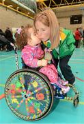 13 October 2012; Pictured at a major Paralympic Talent Search Event, supported by Cadbury, is Paralympic medallist Catherine O'Neill, from New Ross, Co. Wexford, getting a kiss from 2 year old Sophia Mulvaney, from Drumcondra, Co. Dublin. The event took place today at UCD Sports Centre and aimed to encourage people with a physical disability to get involved in sport and to unearth potential Irish talent for the Rio 2016 Paralympic Games. Athletes from Ireland’s most successful Paralympic Team were in attendance, alongside 18 exhibiting sports and various demonstrations. The sponsorship of the event by Cadbury forms a natural extension of the brand’s sponsorship of the Irish Paralympic and Olympic Teams at the London 2012 Games. Anyone with a physical disability or visual impairment that are keen to get involved in sport, can log onto www.paralympics.ie for further details. Paralympics Ireland Talent Search Event, UCD Sports Centre, University College Dublin, Belfield, Dublin. Photo by Sportsfile