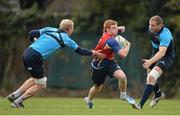 15 October 2012; Leinster's Cathal Marsh is tackled by Leo Cullen, left, and Damian Browne, right, during squad training ahead of their side's Heineken Cup, Pool 5, Round 2, game against Scarlets on Saturday. Leinster Rugby Squad Training, Rosemount, UCD, Belfield, Dublin. Picture credit: Stephen McCarthy / SPORTSFILE