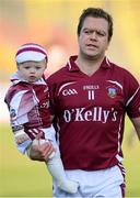 21 October 2012; Arles Kilcruise captain Chris Conway with his one year old son George in the pre-match parade. Laois County Senior Football Championship Final, Portlaoise v Arles Kilcruise, O'Moore Park, Portlaoise, Co. Laois. Photo by Sportsfile