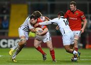 26 October 2012; Damien Varley, Munster, is tackled by Andries Van Schalkwyk and David Odiete, right, Zebre. Celtic League 2012/13, Round 7, Munster v Zebre, Thomond Park, Limerick. Picture credit: Matt Browne / SPORTSFILE