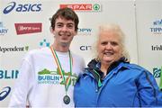 29 October 2012; National men's marathon champion Paul Pollock, Co. Down, with Georgina Drumm, Vice President, Athletics Association of Ireland, after during the Dublin Marathon 2012. Merrion Square, Dublin. Picture credit: Brendan Moran / SPORTSFILE