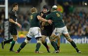 10 November 2012; Mike Ross, Ireland, is tackled by Duane Vermeulen, left, and Juandré Kruger, South Africa. Autumn International, Ireland v South Africa, Aviva Stadium, Lansdowne Road, Dublin. Picture credit: Ray McManus / SPORTSFILE
