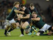 10 November 2012; Cian Healy, Ireland, is tackled by Pat Lambie, left, and Pat Cilliers, South Africa. Autumn International, Ireland v South Africa, Aviva Stadium, Lansdowne Road, Dublin. Picture credit: Ray McManus / SPORTSFILE