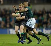 10 November 2012; Keith Earls, Ireland, is tackled by JP Pietersen and Ruan Pienaar, South Africa. Autumn International, Ireland v South Africa, Aviva Stadium, Lansdowne Road, Dublin. Picture credit: Ray McManus / SPORTSFILE