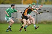 14 November 2012; William O'Donoghue, Ard Scoil Rís, in action against James Neville, left, and Shane Moroney, St Colman's. Munster Colleges Dr. Harty Cup Senior A Hurling, Ard Scoil Rís, Limerick v St Colman's, Fermoy. Cahir, Co. Tipperary. Picture credit: Diarmuid Greene / SPORTSFILE