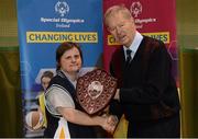 24 November 2012; Former RTE GAA commentator Michéal O Muircheartaigh presents the Women's National Basketball Plate to Connaught captain Agnes Melvin. 2012 Special Olympics Ireland National Women's Basketball Plate, Gormanston College, Co. Meath. Photo by Sportsfile