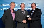 24 November 2012; Referee Maurice Condon, from Waterford, is presented with his All-Ireland Junior Football Championship referees' medal by Uachtarán Chumann Lúthchleas Gael Liam Ó Néill, right, and Chairman of the National Referees Committee, Pat McEnaney. 2012 National Referees' Awards Banquet, Croke Park, Dublin. Picture credit: Barry Cregg / SPORTSFILE