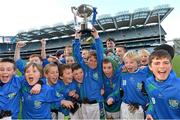 27 November 2012; St Oliver Plunkett Malahide captain David McCormack lifts the cup alongside his team-mates. Allianz Cumann na mBunscol Finals, St Oliver Plunkett Malahide v St Patrick’s Hollypark. Some 1,200 players took part over the two day finals. Croke Park, Dublin. Picture credit: Brian Lawless / SPORTSFILE