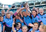 27 November 2012; Scoil Lorcáin Baile na Manach captain Gráinne Ní Drisceoil lifts the cup with her team-mates. Allianz Cumann na mBunscol Finals, St Brigid’s Castleknock v Scoil Lorcáin Baile na Manach. Some 1,200 players took part over the two day finals. Croke Park, Dublin. Picture credit: Brian Lawless / SPORTSFILE