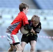 27 November 2012; The Terenure Junior School captain Seamus Noone is tackled by his opposite number Joseph Sweeney during his side's 1-13 to 2-6 victory over Divine Word Marley in the Corn Mhic Chaoilte at the Allianz Cumann na mBunscol Finals, Croke Park, Dublin. Some 1,200 players took part in the finals which were played at the GAA head quarters over the last two days. Picture credit: Ray McManus / SPORTSFILE