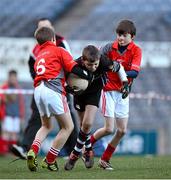 27 November 2012; Ewan Sweeney, Terenure Junior School, is tackled by Divine Word Marley players Jack Whelan, left, and Dáire Casserly during his side's 1-13 to 2-6 victory over Divine Word Marley in the Corn Mhic Chaoilte at the Allianz Cumann na mBunscol Finals, Croke Park, Dublin. Some 1,200 players took part in the finals which were played at the GAA head quarters over the last two days. Picture credit: Ray McManus / SPORTSFILE