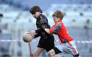 27 November 2012; Daniel Byrne, Terenure Junior School, is tackled by Cian Deignan, Divine Word Marley, during his side's 1-13 to 2-6 victory over Divine Word Marley in the Corn Mhic Chaoilte at the Allianz Cumann na mBunscol Finals, Croke Park, Dublin. Some 1,200 players took part in the finals which were played at the GAA head quarters over the last two days. Picture credit: Ray McManus / SPORTSFILE