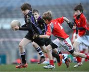 27 November 2012; Daniel Byrne, Terenure Junior School, is tackled by Cian Deignan, Divine Word Marley, during his side's 1-13 to 2-6 victory over Divine Word Marley in the Corn Mhic Chaoilte at the Allianz Cumann na mBunscol Finals, Croke Park, Dublin. Some 1,200 players took part in the finals which were played at the GAA head quarters over the last two days. Picture credit: Ray McManus / SPORTSFILE