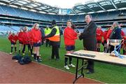 27 November 2012; Uachtarán Chumann Lúthchleas Gael Liam Ó Néill presents the winners medals to the St Brigid’s Cabinteely players. Allianz Cumann na mBunscol Finals, St Brigid’s Cabinteely v Belgrove GNS Clontarf, Croke Park, Dublin. Some 1,200 players took part in the finals which were played at the GAA head quarters over the last two days. Picture credit: Brian Lawless / SPORTSFILE