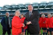 27 November 2012; Zara Mee, St Brigid’s Cabinteely, is presented with her winners medal by Uachtarán Chumann Lúthchleas Gael Liam Ó Néill. Allianz Cumann na mBunscol Finals, St Brigid’s Cabinteely v Belgrove GNS Clontarf, Croke Park, Dublin. Some 1,200 players took part in the finals which were played at the GAA head quarters over the last two days. Picture credit: Brian Lawless / SPORTSFILE