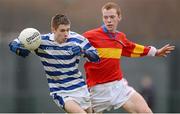 11 January 2013; Michael Keogh, Knockbeg College, in action against Andrew Foley, St. Fintan's H.S., Sutton. Leinster Colleges Senior Football &quot;A&quot;, Round 1, St. Fintan’s H.S., Sutton v Knockbeg College, Parnells GAA Club, Dublin. Photo by Sportsfile