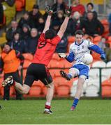 20 January 2013; Conor McManus, Monaghan, scoring a point dispite the attempted tackle of Kevin McKernan, Down. Power NI Dr. McKenna Cup, Semi-Final, Monaghan v Down, Athletic Grounds, Armagh. Picture credit: Oliver McVeigh / SPORTSFILE