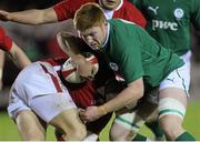 1 February 2013; Steffan Hughes, Wales, is tackled by Conor Joyce, Ireland. U20 Six Nations Rugby Championship, Wales v Ireland, Parc Eirias, Wales. Picture credit: Steve Pope / SPORTSFILE