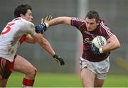 3 February 2013; Michael Martin, Galway, is tackled by Dermot McBride, Derry. Allianz Football League, Division 2, Galway v Derry, Pearse Stadium, Salthill, Galway. Picture credit: Barry Cregg / SPORTSFILE