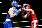 8 February 2013; Martin Keenan, left, Ennis, exchanges punches with John Connors, Thurles, during their 91kg Novice Final bout. National Elite Boxing Championships Preliminaries, National Stadium, Dublin. Photo by Sportsfile