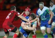 8 February 2013; Jason Harris-Wright, Connacht, is tackled by Kieran Murphy and Adam Warren, Scarlets. Celtic League 2012/13, Round 14, Scarlets v Connacht, Parc Y Scarlets, Llanelli, Wales. Picture credit: Steve Pope / SPORTSFILE