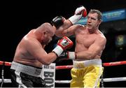 9 February 2013; Martin Rogan, Belfast, right, exhanges punches with Ladislav Kovarik, Czech Republic, during their Heavyweight contest. Betfair's Unfinished Business Fight Night, Odyssey Arena, Belfast, Co. Antrim. Photo by Sportsfile