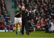 10 February 2013; Simon Zebo, Ireland, leaves the pitch with team doctor Dr. Eanna Falvey. RBS Six Nations Rugby Championship, Ireland v England, Aviva Stadium, Lansdowne Road, Dublin. Picture credit: Stephen McCarthy / SPORTSFILE