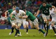 10 February 2013; James Haskell, England, is tackled by Cian Healy, Ireland, with support from team mate Mike McCarthy, right. RBS Six Nations Rugby Championship, Ireland v England, Aviva Stadium, Lansdowne Road, Dublin. Picture credit: Brendan Moran / SPORTSFILE