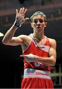 15 February 2013; Michael Conlon, St. John Bosco, Belfast, celebrates victory over Ruairi Dalton, Holy Trinity, Belfast, after their 52kg bout. National Elite Boxing Championships, Semi-Finals, National Stadium, Dublin. Picture credit: Pat Murphy / SPORTSFILE