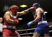 15 February 2013; Sean Turner, Drimnagh, left, exchanges punches with Dean Gardiner, Clonmel, during their 91+kg bout. National Elite Boxing Championships, Semi-Finals, National Stadium, Dublin. Picture credit: Pat Murphy / SPORTSFILE