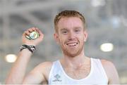 17 February 2013; John Travers, Donore Harriers A.C., after winning the men's 3000m final. Woodie’s DIY AAI Senior Indoor Championships, Athlone Institute of Technology International Arena, Athlone, Co. Westmeath. Picture credit: Stephen McCarthy / SPORTSFILE