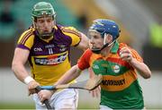 24 February 2013; John Corcoran, Carlow, in action against Stephen Murphy, Wexford. Allianz Hurling League, Division 1B, Carlow v Wexford, Dr. Cullen Park, Carlow. Picture credit: David Maher / SPORTSFILE