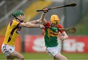 24 February 2013; Hugh Paddy O'Byrne, Carlow, in action against Gary Moore, Wexford. Allianz Hurling League, Division 1B, Carlow v Wexford, Dr. Cullen Park, Carlow. Picture credit: David Maher / SPORTSFILE