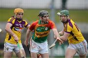 24 February 2013; Padraig Nolan, Carlow, in action against David Redmond, left, and Harry Kehoe, Wexford. Allianz Hurling League, Division 1B, Carlow v Wexford, Dr. Cullen Park, Carlow. Picture credit: David Maher / SPORTSFILE