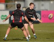 27 February 2013; Ulster's Paddy Jackson in action against team-mate Ruan Pienaar during squad training ahead of their Celtic League 2012/13 match against Benetton Treviso on Friday. Ulster Rugby Squad Training, Ravenhill Park, Belfast, Co. Antrim. Picture credit: Oliver McVeigh / SPORTSFILE