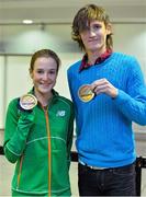 4 March 2013; Ireland's bronze medallists Fionnuala Britton, from Kilcoole, Co. Wicklow, and Ciarán O Lionaird, from Macroom, Co. Cork, with their medals on the Irish team's return from the 2013 European Indoor Athletics Championships in Gothenburg, Sweden. Dublin Airport, Dublin. Picture credit: Barry Cregg / SPORTSFILE