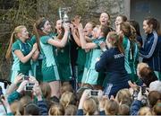 5 March 2013; Jane Fennelly, captain, Mount Anville, second from left, lifts the cup with her team-mates. Leinster Senior Schoolgirls Cup Final, Mount Anville v Rathdown, Grange Road, Dublin. Picture credit: Brian Lawless / SPORTSFILE