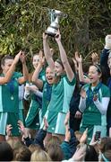 5 March 2013; Jane Fennelly, captain, Mount Anville, lifts the cup with her team-mates. Leinster Senior Schoolgirls Cup Final, Mount Anville v Rathdown, Grange Road, Dublin. Picture credit: Brian Lawless / SPORTSFILE